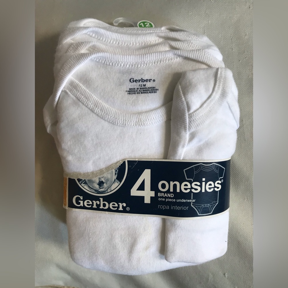 Pack of 4 Gerber white cotton onesies. Never worn.